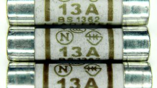 Close up of three 13A plug fuses