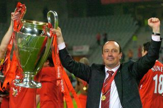 Manager Rafael Benitez celebrates with the Champions League trophy after Liverpool's victory over Milan in the 2005 final