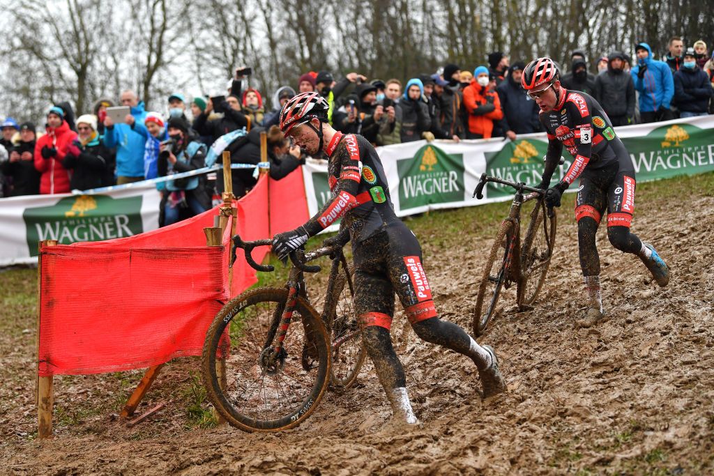 BESANCON FRANCE NOVEMBER 28 LR Laurens Sweeck of Belgium and Team Pauwels Sauzen Bingoal and Ryan Kamp of The Netherlands and Team Pauwels Sauzen Bingoal compete during the 6th Besanon UCI CycloCross Worldcup 2021 Mens Elite CXWorldCup UCIcyclocrossWC on November 28 2021 in Besancon France Photo by Luc ClaessenGetty Images