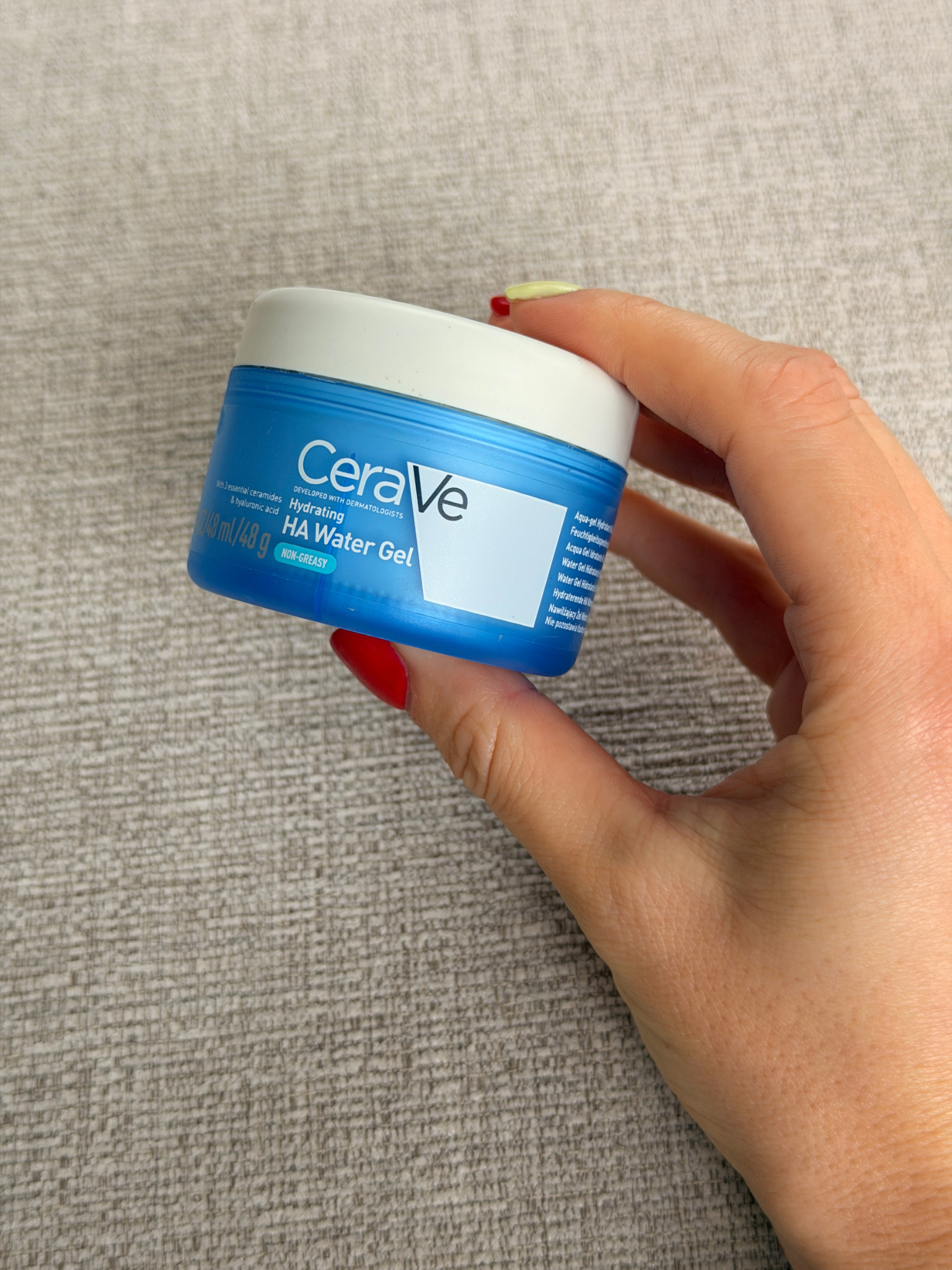 Freelance beauty editor Grace Day holding the CeraVe moisturiser