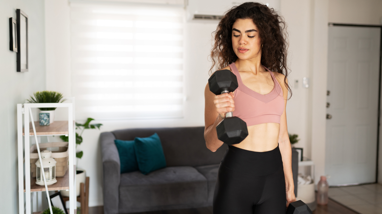 Woman doing dumbbell bicep curl