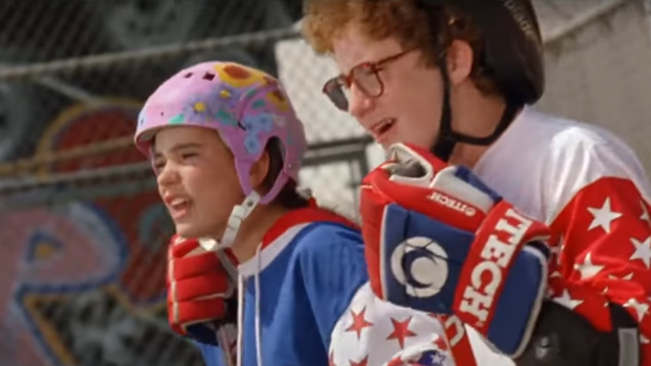 Connie and Averman yell on the sidelines during a street hockey game.