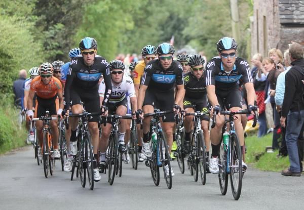 Sky leads the peloton on the first climb