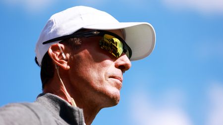 A close up of Mike Weir wearing sunglasses and a white cap