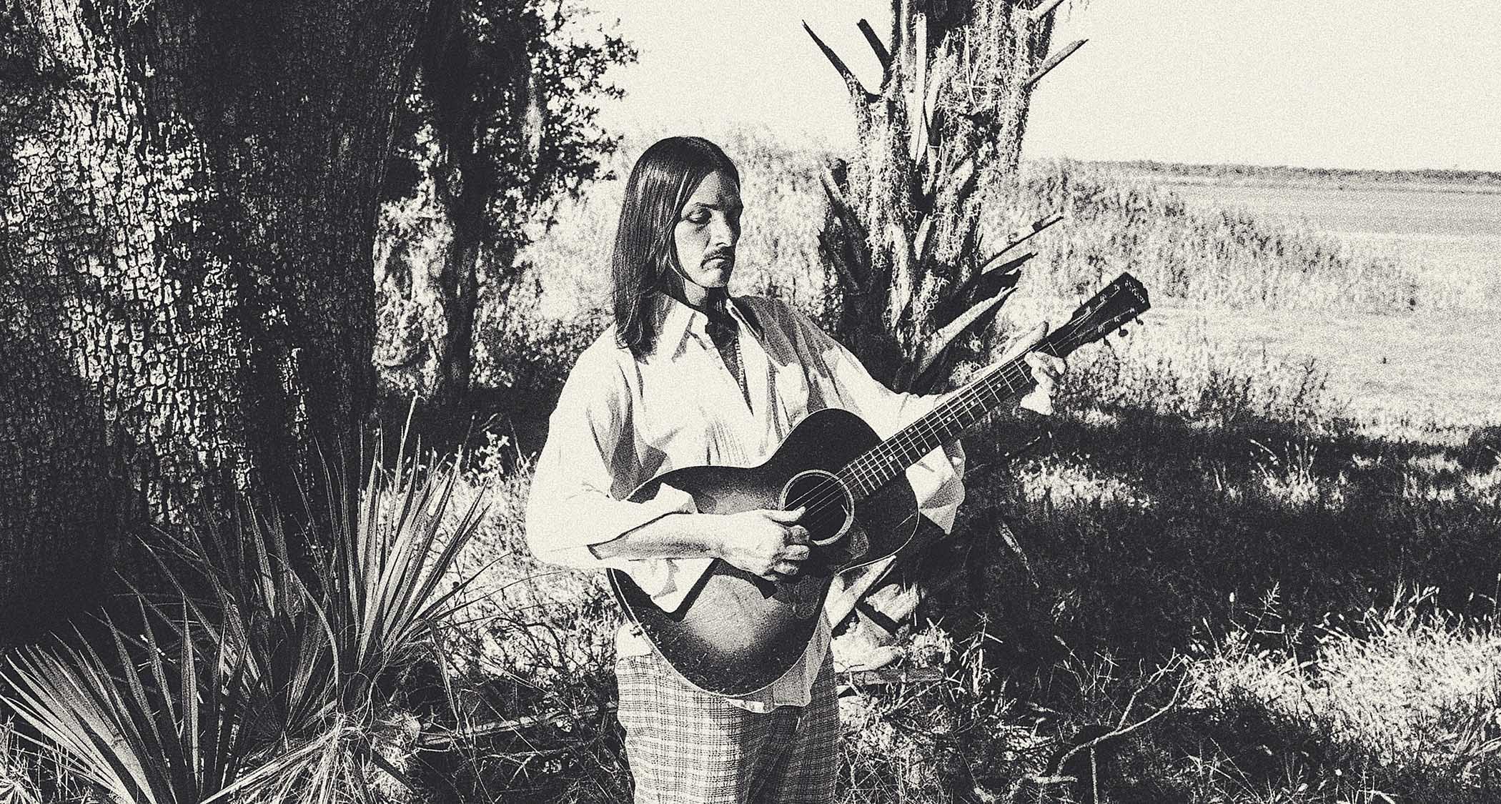 Duane Betts is pictured with his Gibson acoustic