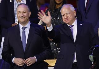 Second Gentleman Doug Emhoff and Democratic vice presidential candidate Minnesota Gov. Tim Walz during the first day of the Democratic National Convention at the United Center on August 19, 2024 in Chicago, Illinois.