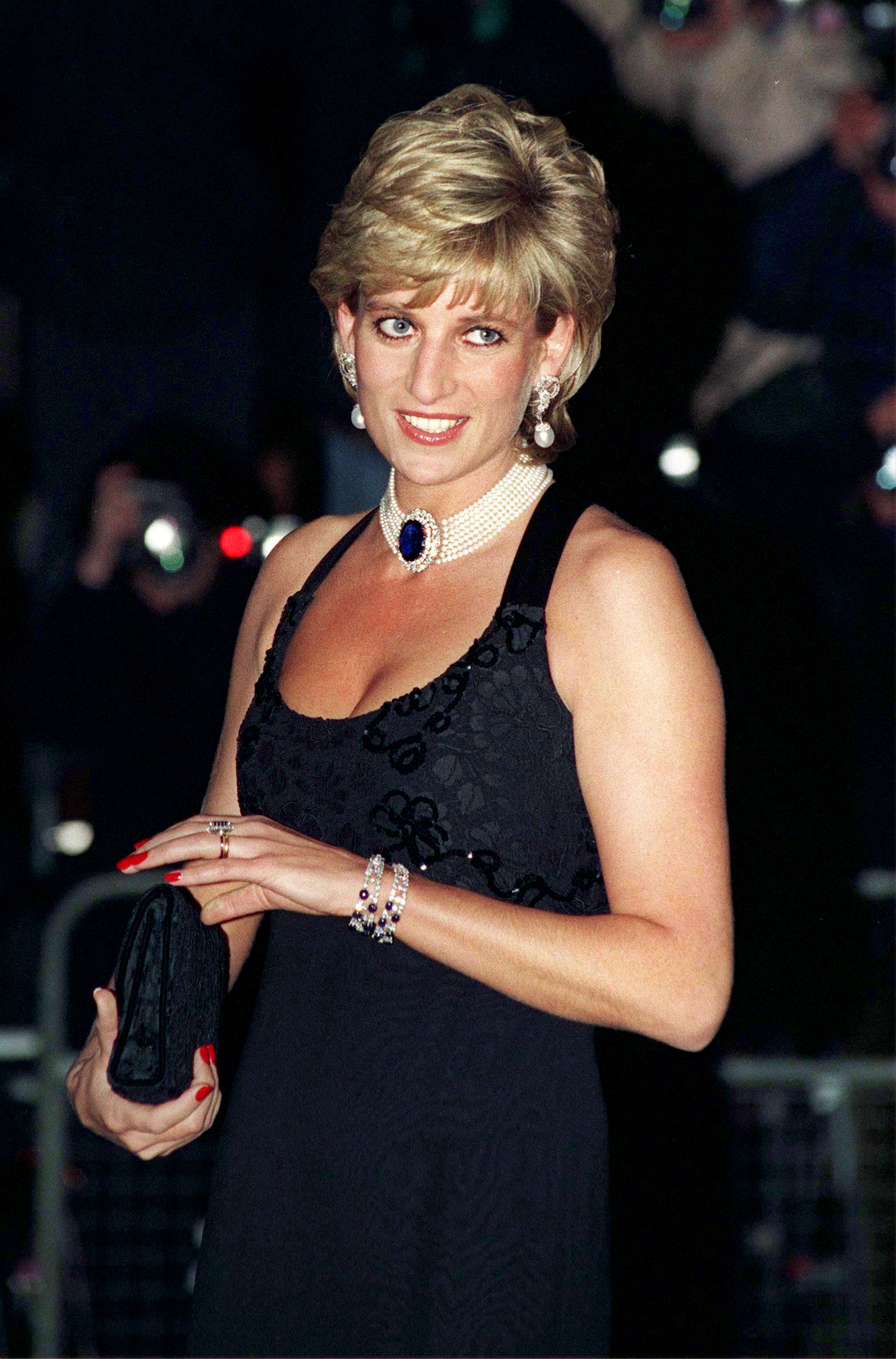 Princess Diana wearing a black dress and pearl choker on November 20, 1995