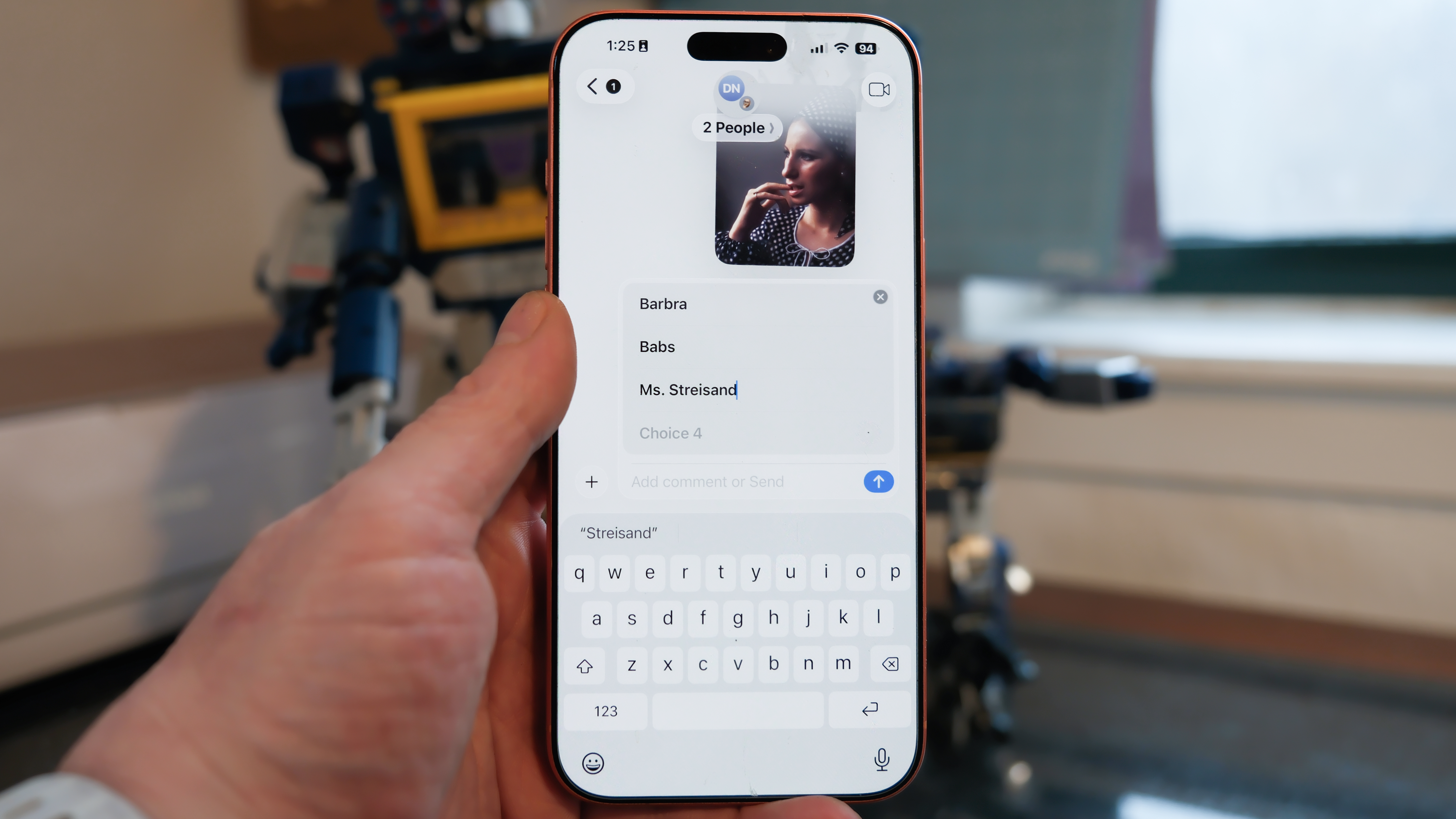 Apple iPhone 16 Pro Max in orange showing various Apple Messages features including sending check-ins, Apple Cash, and doodles