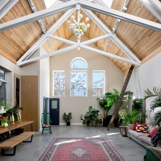 living room in chapel conversion with white painted beams