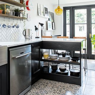 black and white kitchen with stainless steel dishwasher