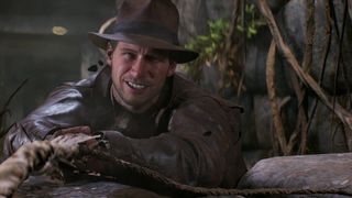 Indiana Jones and the Great Circle Indy hanging onto a vine as in Raiders of the Lost Ark