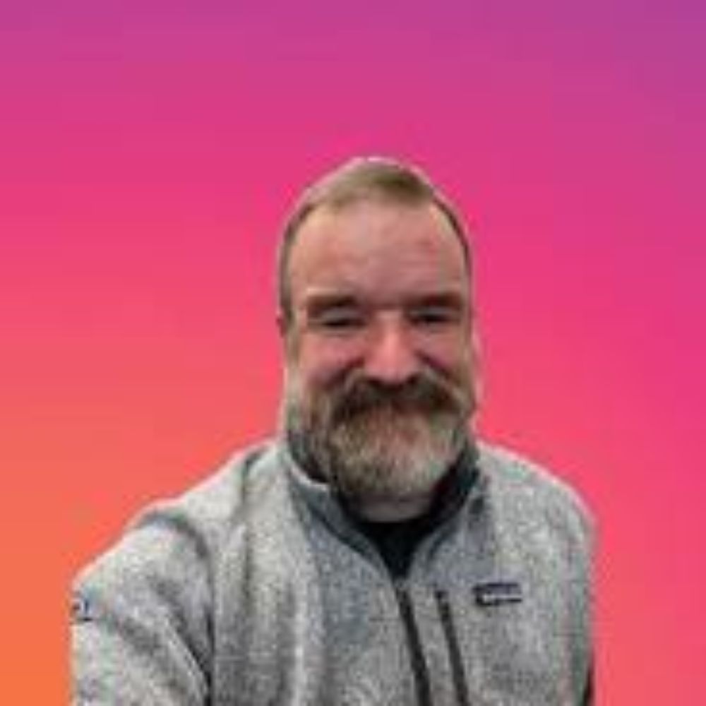 A headshot of Adam Goess