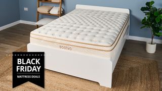 The Saatva Classic mattress in a blue bedroom and placed on a white wooden bedframe with a Black Friday sales badge overlaid on the bottom left hand corner