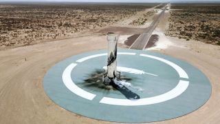 The New Shepard booster on the landing pad after Mission NS-15's success on April 14, 2021.