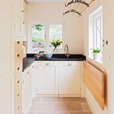 narrow utility room wooden cabinets