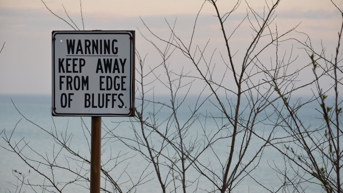 Warning sign at Scarborough Bluffs, overlooking Lake Ontario, Canada