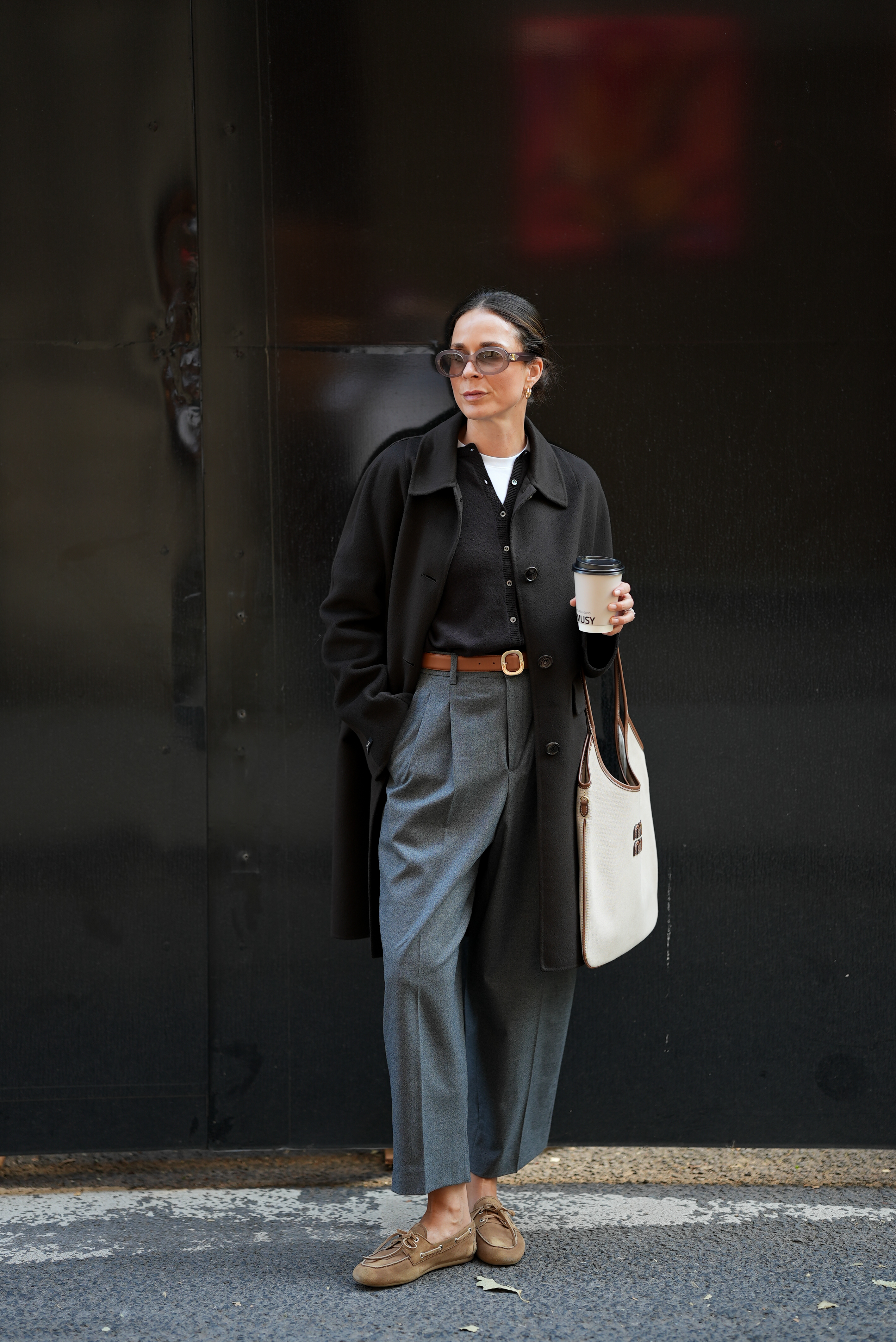 woman wearing cardigan, coat, and tailored trousers
