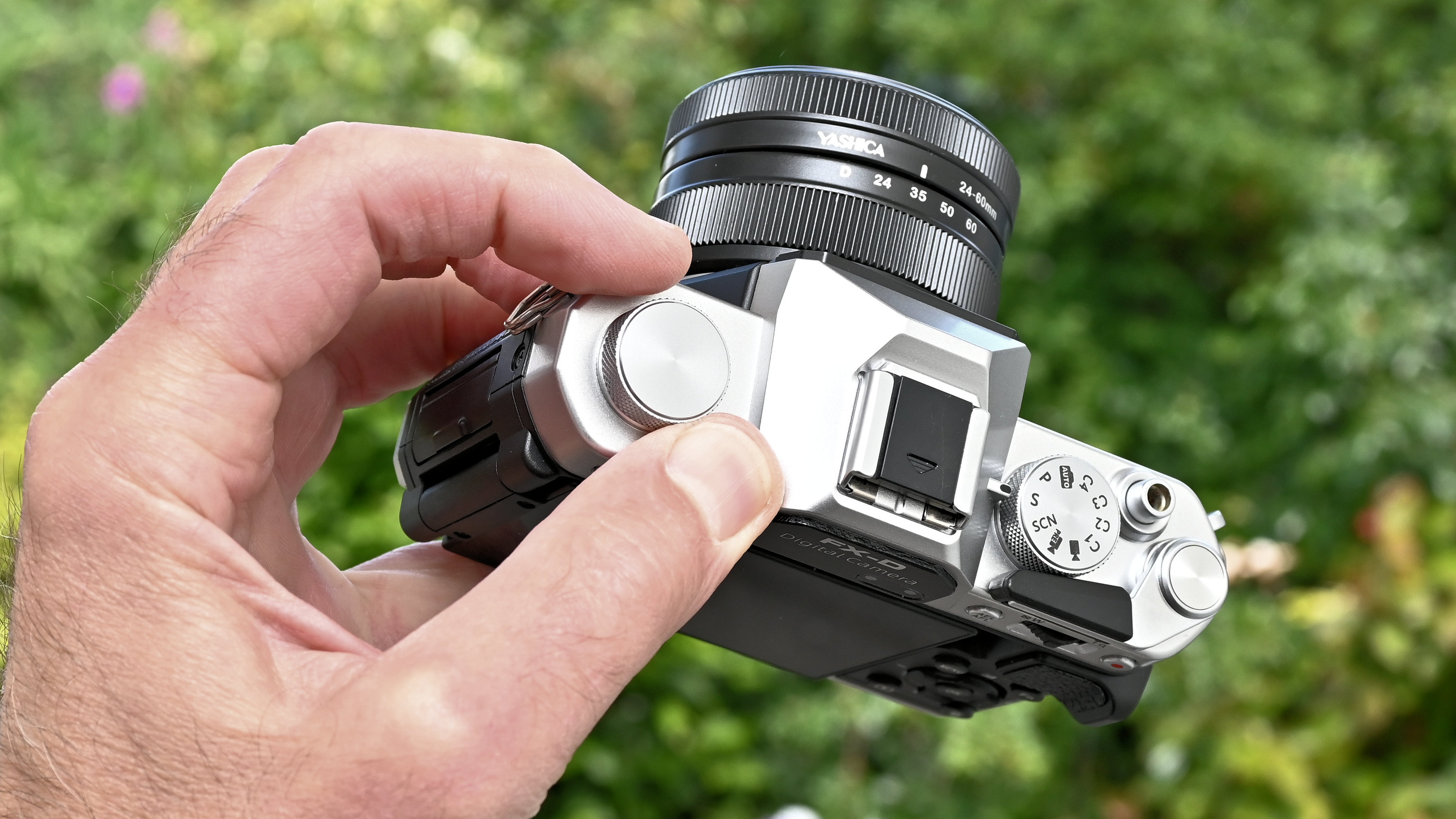 Yashica FX-D 300 product shot, camera held in hand