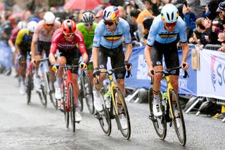 Belgium's Tiesj Benoot and Wout van Aert lead the select favourites group late in the road race at the 2023 UCI Road World Championships in Glasgow