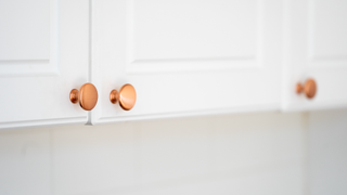 Kitchen cupboard with gold handles