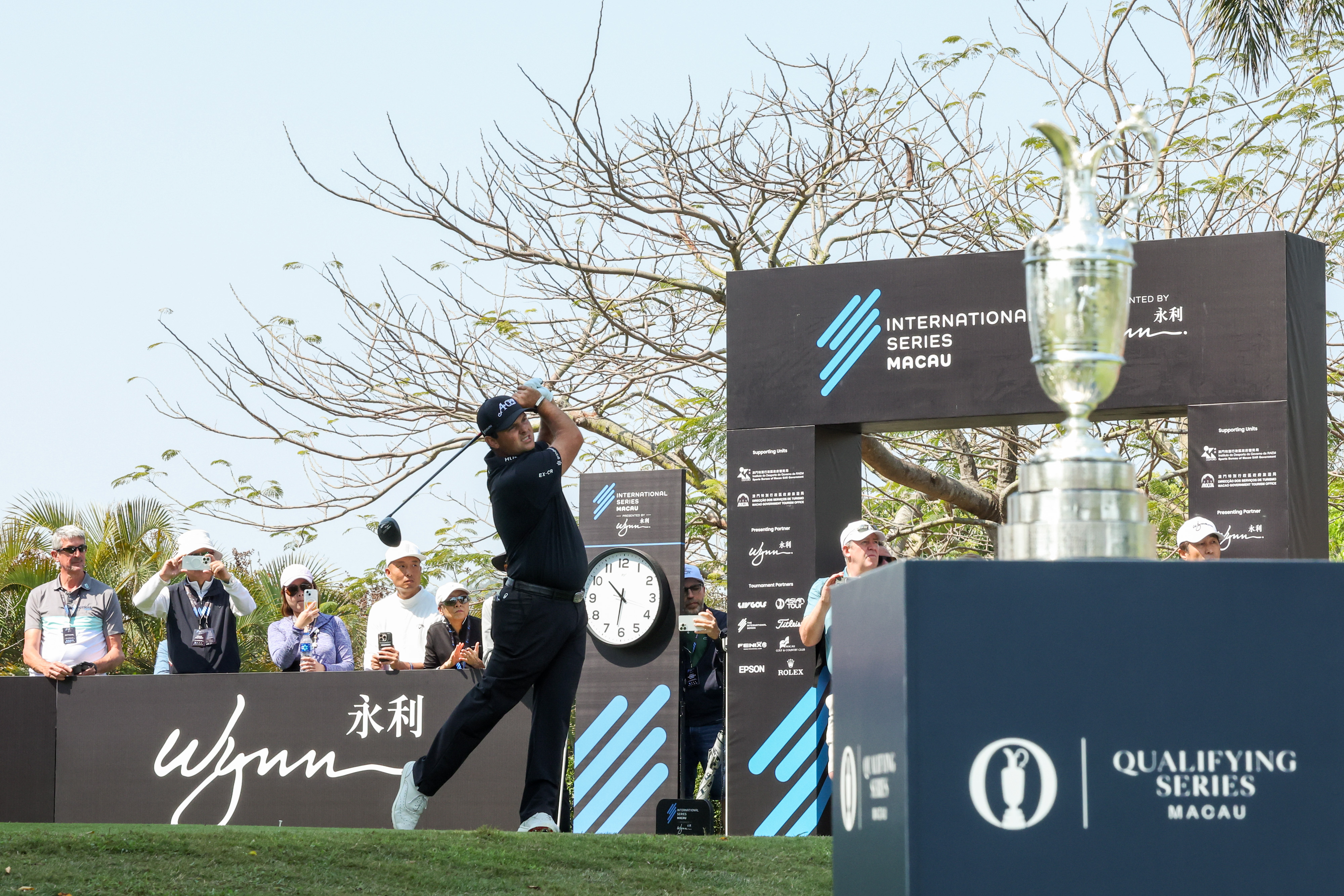 Patrick Reed hits a driver during the International Series Macau