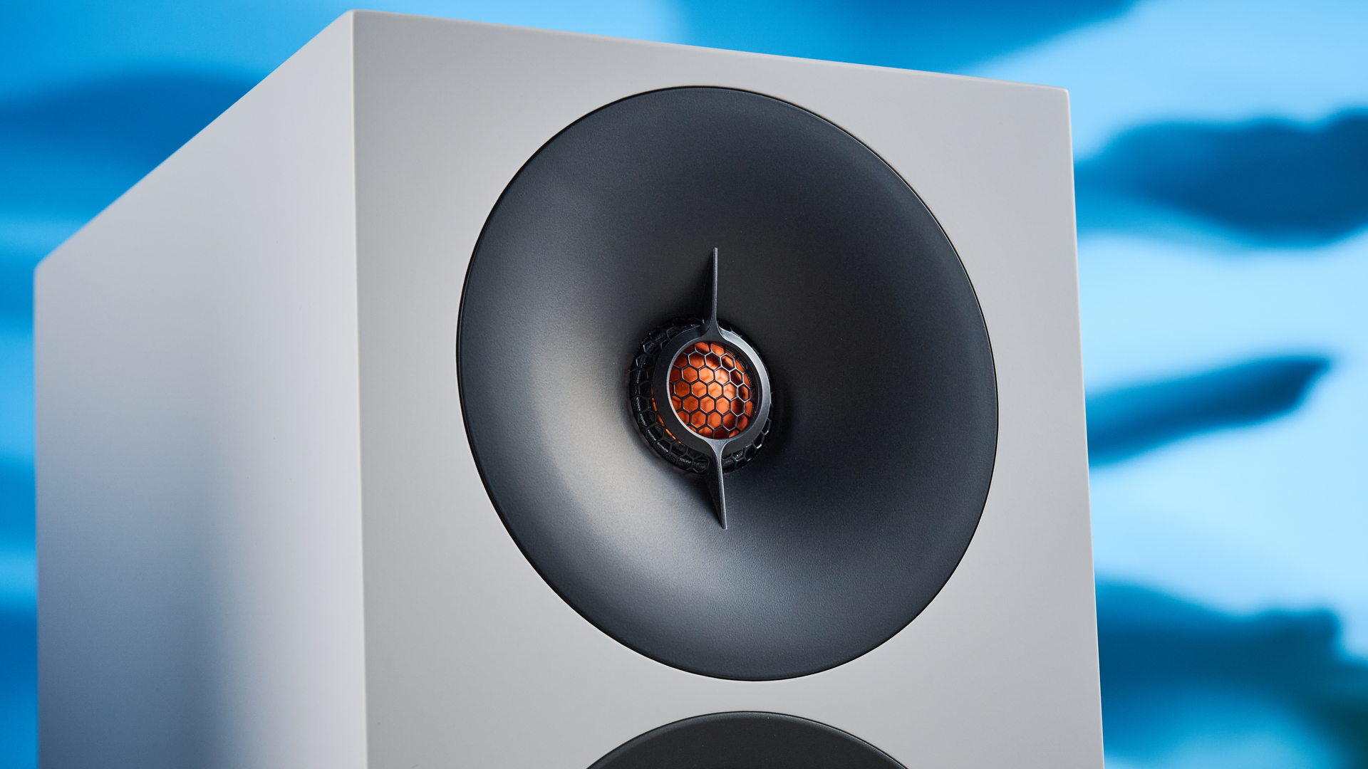 the cambridge audio l/r s bookshelf speakers in white with a 21mm aluminum tweeter and a 3-inch woofer photographed against the blue tom's guide background