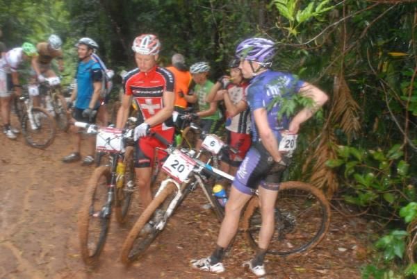 The lead group awaits instructions on how to ride to the finish after the stage is neutralized