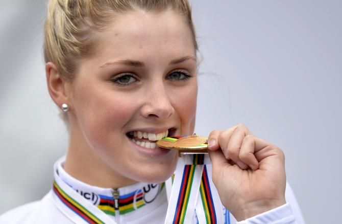 Macey Stewart (Australia) checks how much gold is in her medal