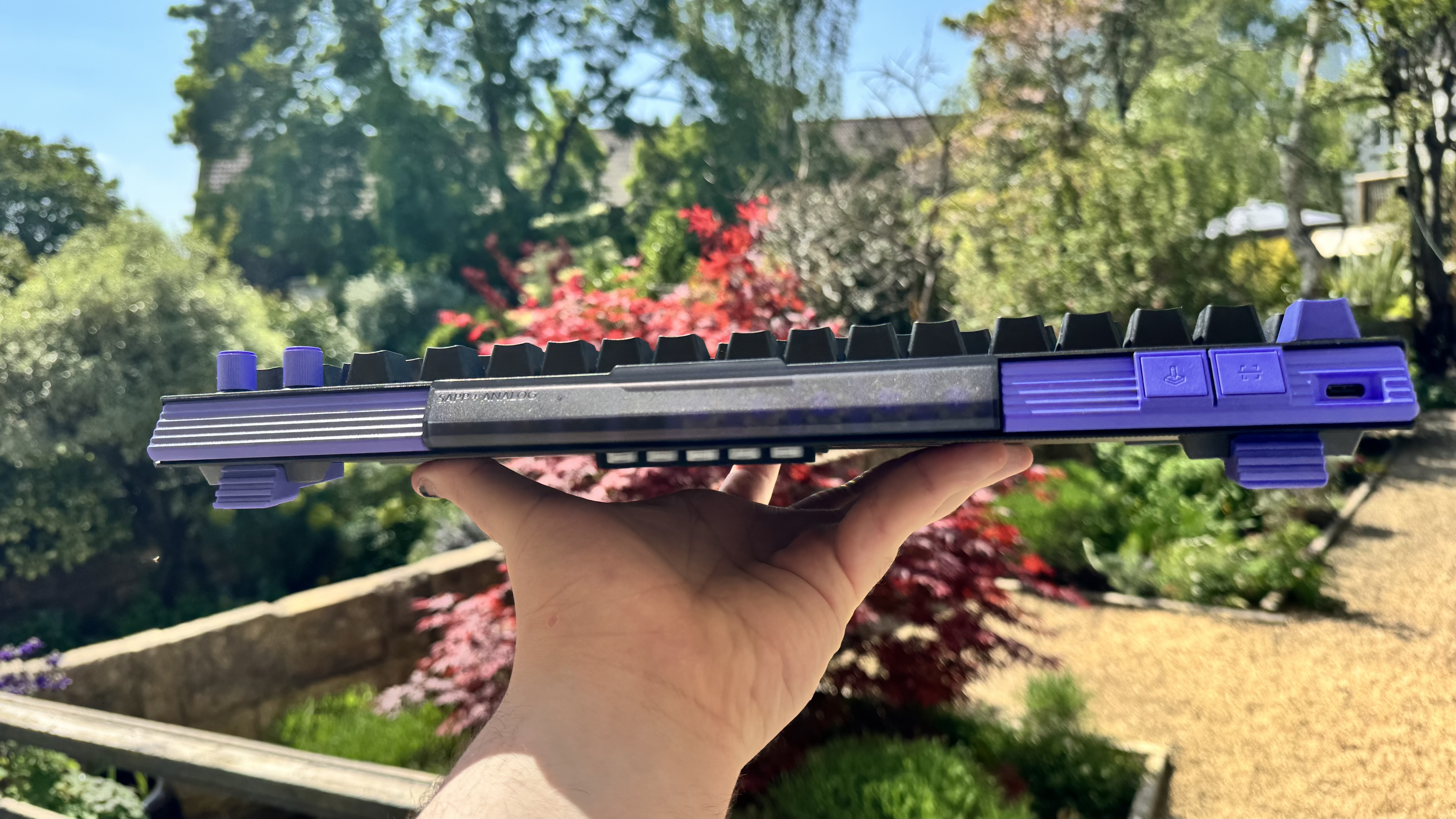 The Logitech G512 X gaming keyboard from the back, showing off the switch compartment