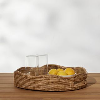 Rattan tray with lemons and glasses