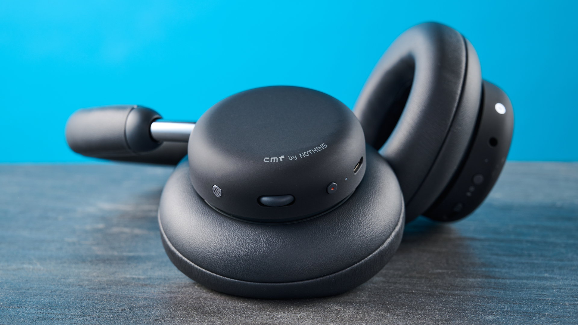 the cmf headphone pro / cmf by nothing headphone pro / nothing headphone pro in black photographed against a blue tom's guide background