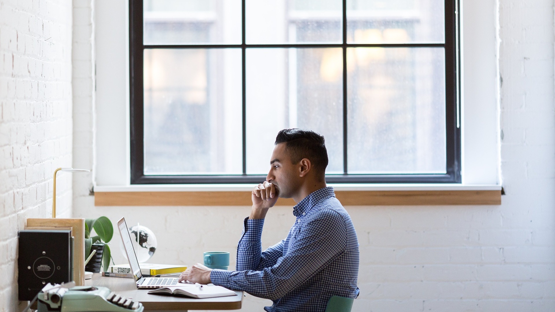 Man searching on the internet in an office environment