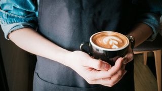 Woman holding coffee