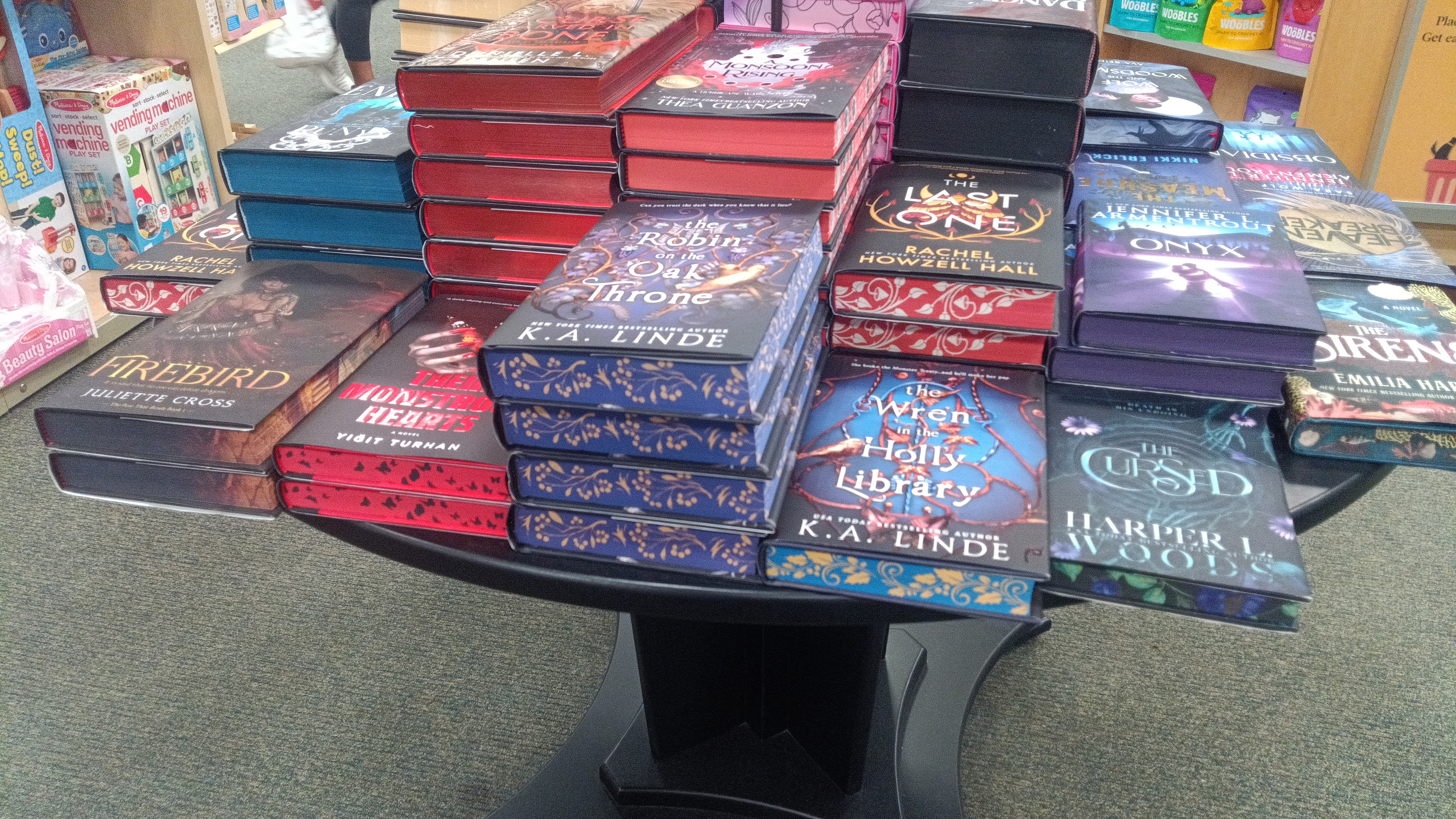 Camera samples from a Bigme HiBreak Pro E Ink smartphone showing colorful books in a bookstore