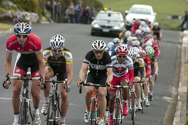 The peloton are over the top of the climb as they try and chase down a breakway rider.