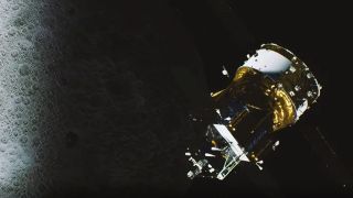 a gold-foil-covered cylindrical spacecraft above the moon