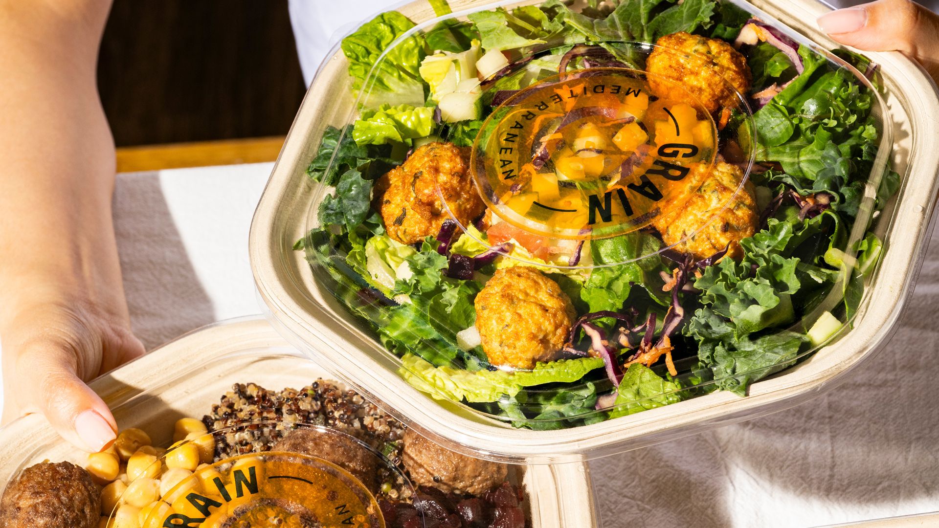an image of two salad bowls from Grain