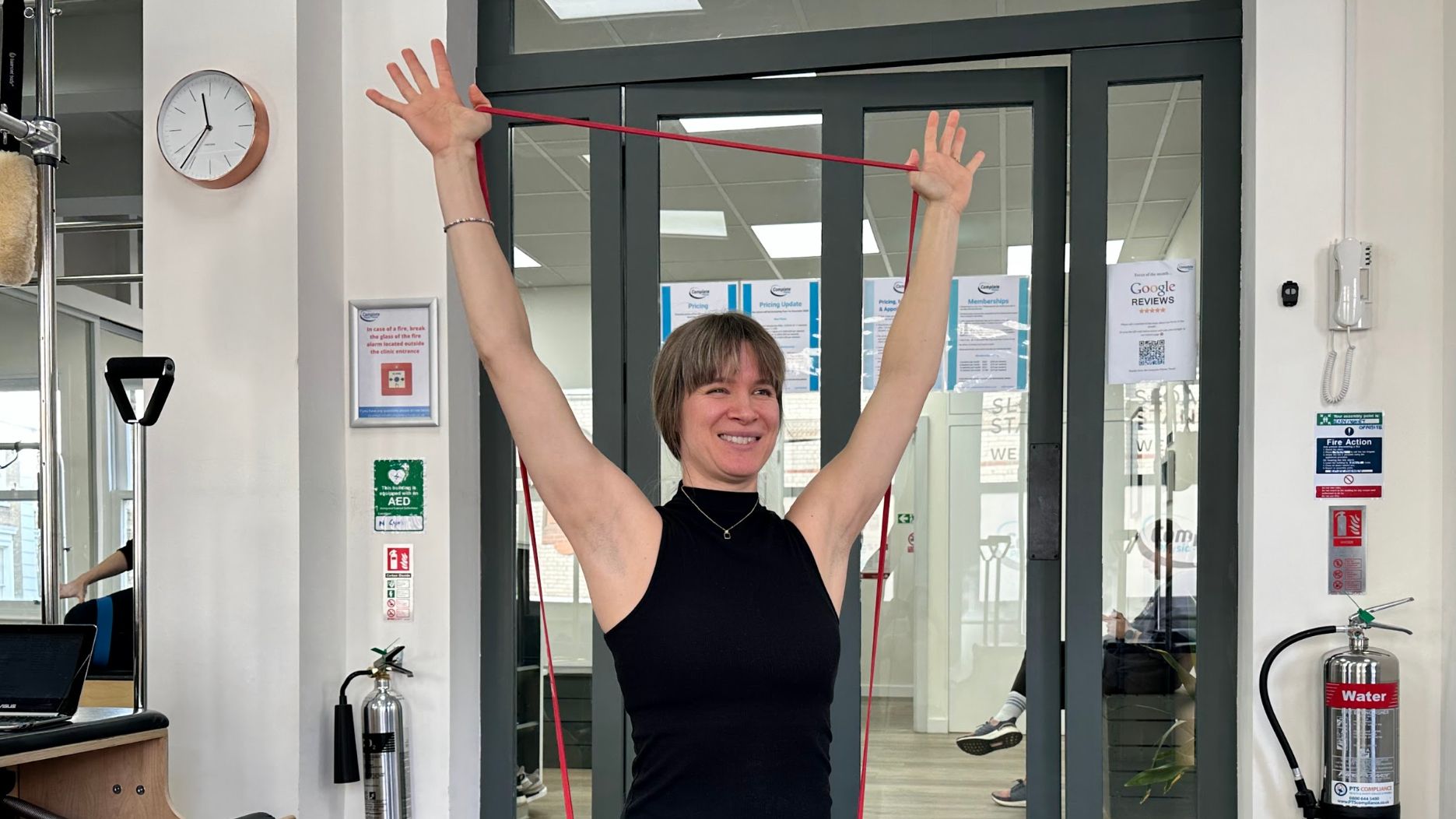 Woman performing a resistance band overhead press