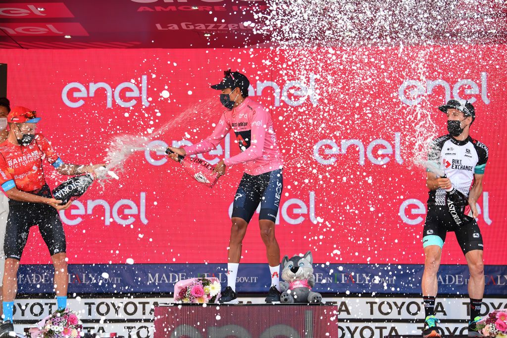 MILAN ITALY MAY 30 Damiano Caruso of Italy and Team Bahrain Victorious Egan Arley Bernal Gomez of Colombia and Team INEOS Grenadiers Pink Leader Jersey Simon Yates of United Kingdom and Team BikeExchange celebrate at podium during the 104th Giro dItalia 2021 Stage 21 a 303km Individual Time Trial stage from Senago to Milano ITT Champagne UCIworldtour girodiitalia Giro on May 30 2021 in Milan Italy Photo by Stuart FranklinGetty Images