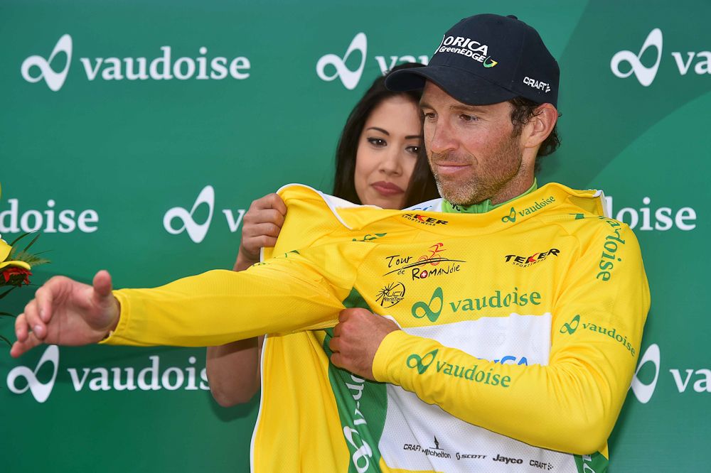 Albasini pulls on the yellow jersey.