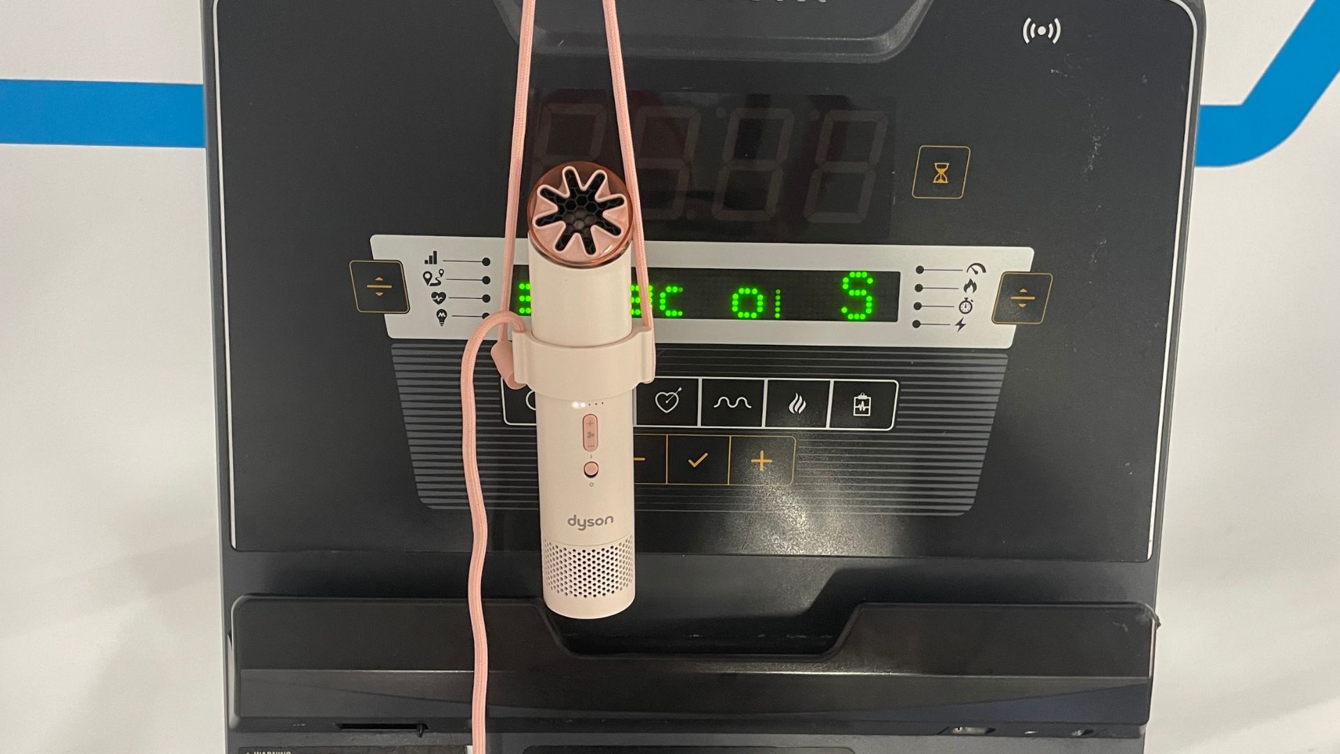 The Dyson HushJet Mini Cool Fan hanging in the gym