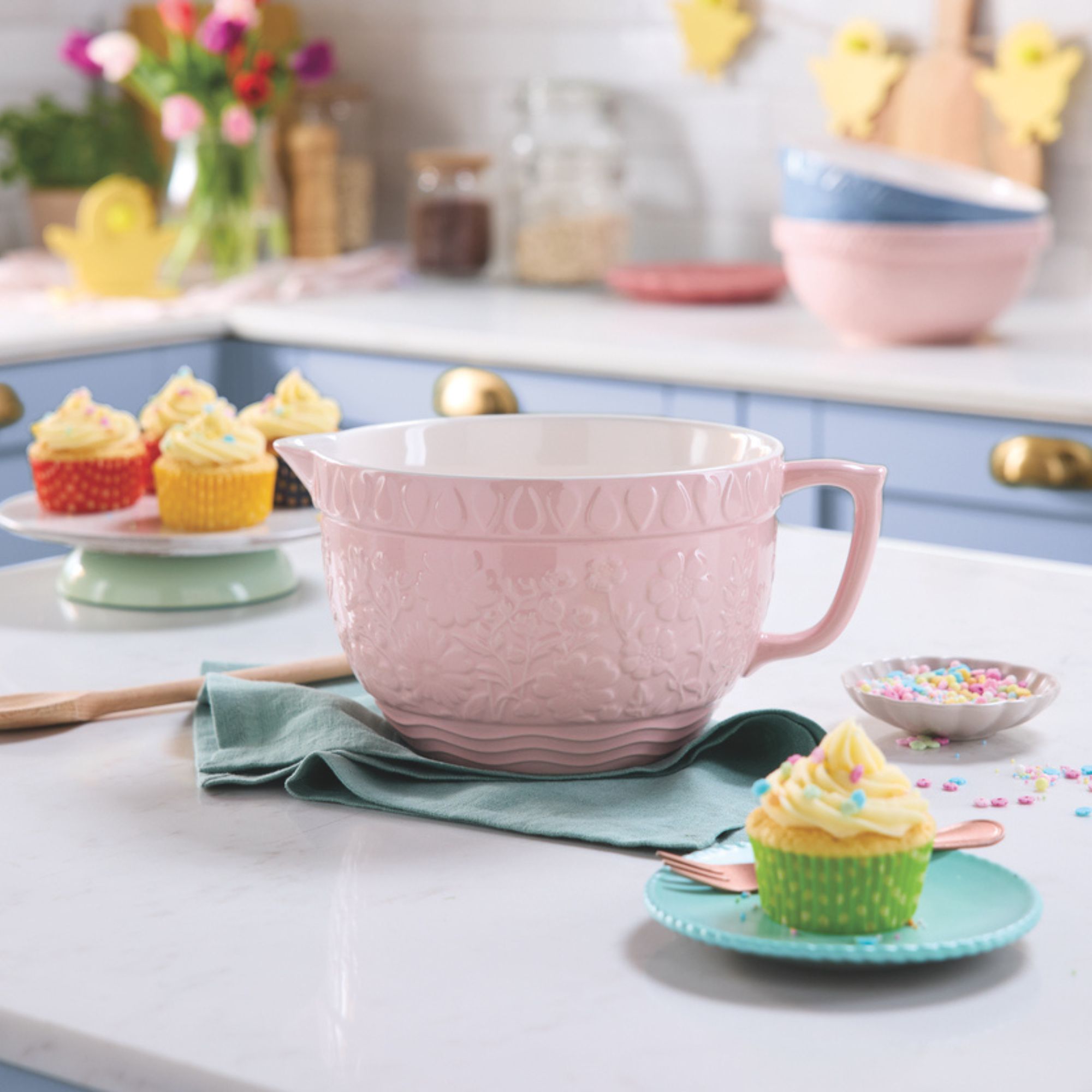 Crofton Ceramic Batter Bowl in pink on worktop next to cupcakes