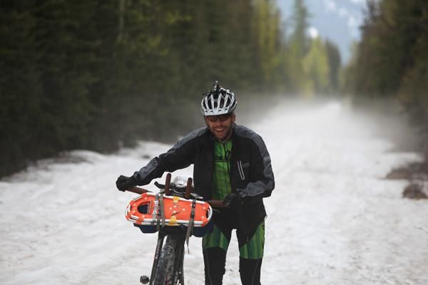 Kurt Refsnider on an eight-mile-long snow slog during the Tour Divide Race in northern Montana.
