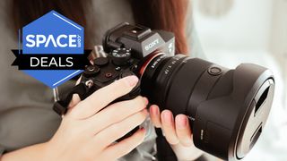 A large Sony camera being held.