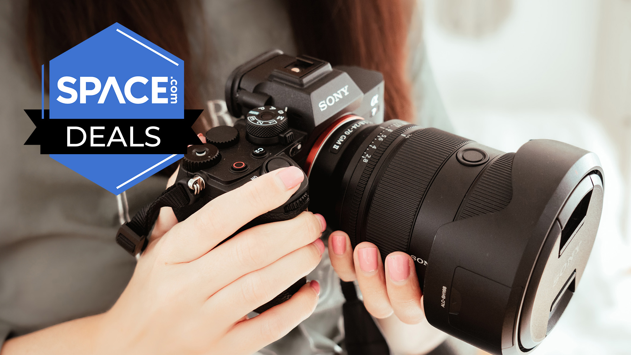 A large Sony camera being held.