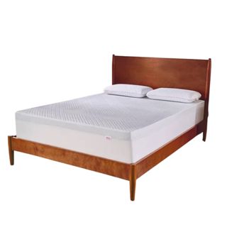 A white twin mattress topper on a wooden bed