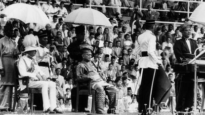 The Duke of Gloucester, the Yang Di-Pertuan Agong and Tunku Abdul Rahman at the Malayan Proclamation of Independence ceremony © Central Press/Getty Images