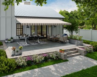 outdoor space with stripe awning, outdoor dining furniture