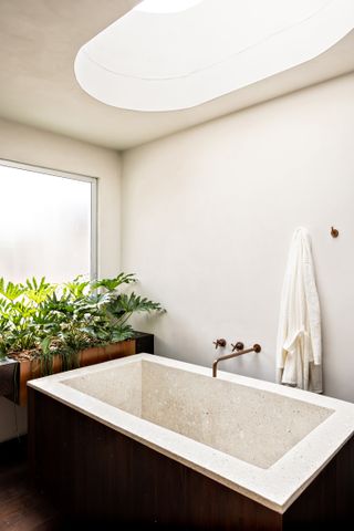 A bathroom with a skylight