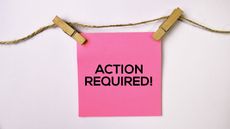 action required note pinned on clothesline for who is required to file